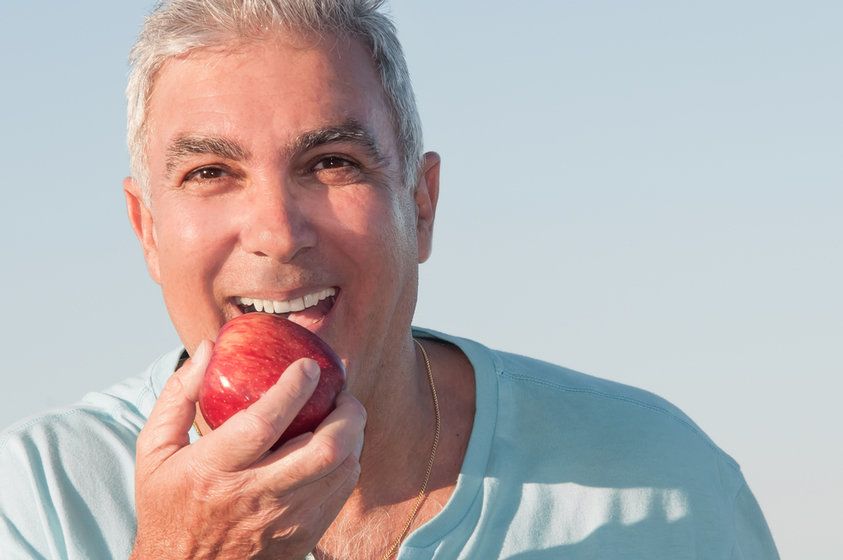 Man Eating Apple